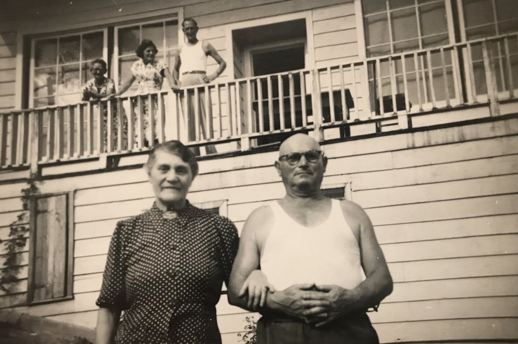 Rose and Dave Saffer standing arm in arm in front of a weatherboard house
