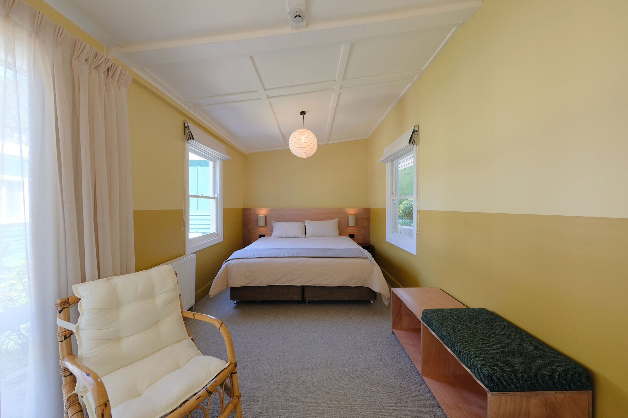 The Saffer Suite with a king bed and cane armchair