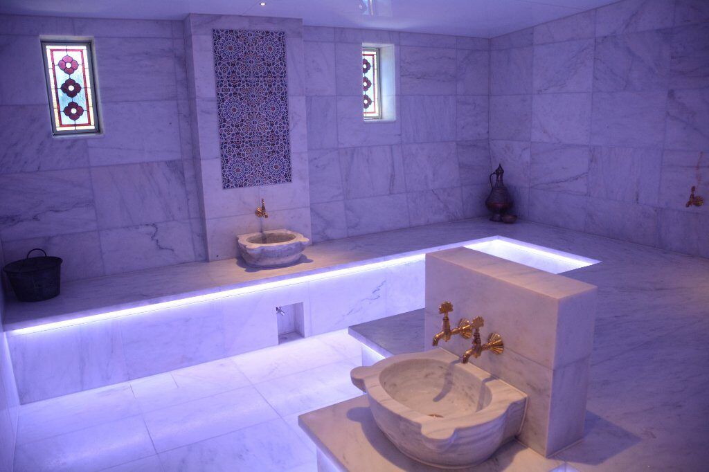 The Turkish hammam the Whitters built: marble, a carved stone basin and stained-glass windows